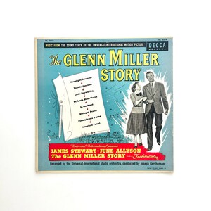 May include: Vintage album cover for "The Glenn Miller Story" soundtrack. The cover features a teal background with the title in yellow and a couple walking. A list of songs is on a scroll. The album is a Decca Records release.