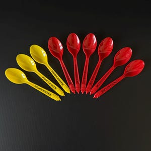 May include: A set of three ceramic mugs with a speckled, matte finish. The mugs are in shades of cream, light gray, and dark gray. Each mug has a simple, minimalist design, perfect for coffee or tea.