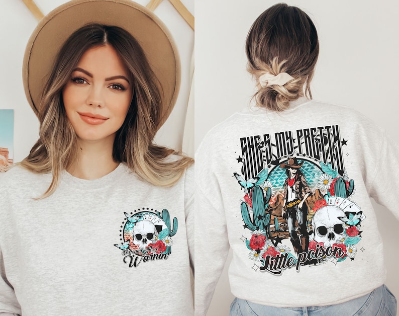 May include: Gray sweatshirt with a skull and crossbones graphic on the front and a graphic of a woman in a cowboy hat with the text "She's my pretty little poison" on the back.