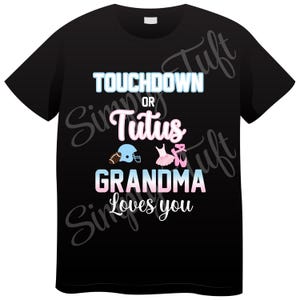May include: Black t-shirt with the text "Touchdown or Tutus Grandma Loves You" in white. A football helmet and a pink and blue tutu are pictured above the text.