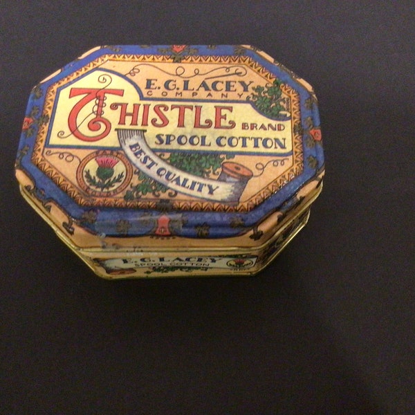Vintage Thistle Brand Cotton Tin-sewing notions are still in cellophane.