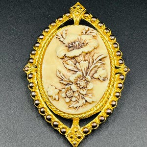 Vintage Victorian Revival Brooch with Floral Carved-Style Center and Gold Tone Frame
