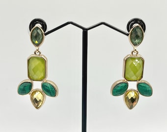May include: Gold-toned statement earrings with a geometric design. Each earring features a green oval-shaped top stone, a large lime green rectangular center stone, and three smaller stones in green and yellow.