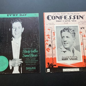 May include: Two vintage sheet music covers featuring Rudy Vallee. The first cover is black and white with the title "Ev'ry Day" and features a photo of Rudy Vallee. The second cover is in color with the title "Confessin' That I Love You" and features a photo of Rudy Vallee.