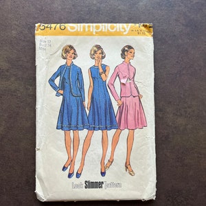May include: Vintage Simplicity sewing pattern number 5476 for a dress and jacket. The pattern is for sizes 12-14 and bust 34. The pattern shows three women wearing the dress and jacket in blue, pink, and white.