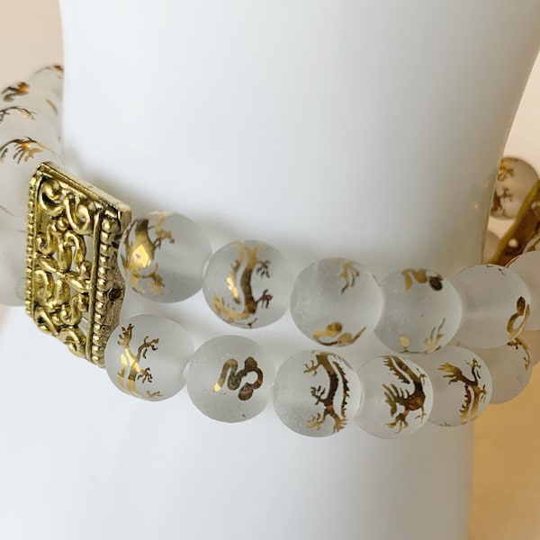 Frosted clear quartz with golden dragon symbols and golden accents energy gemstone duo bracelet 8mm spheres