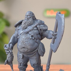 Semi-side view of Half Ogre Bandit Miniature, revealing dynamic pose