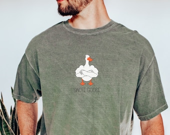 May include: A green t-shirt with a white goose illustration with orange feet and the text "SWOLE GOOSE".