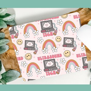 May include: Pink and white mousepad with a repeating pattern of rainbows, flowers, smiley faces, and ultrasound images. The text "Ultrasound Tech" is repeated throughout the design.