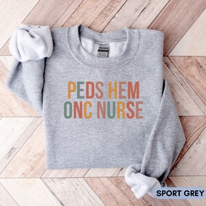Peds Hem Onc Nurse Sweatshirt, Peds Oncology Nurse Crew Neck Sweater ...
