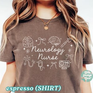 May include: Espresso-colored t-shirt with the words "Neurology Nurse" in white script, accompanied by brain and medical-themed illustrations. The shirt also has the text "espresso (SHIRT)".