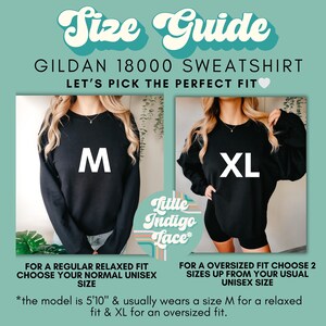 May include: Size guide for a Gildan 18000 sweatshirt. The image shows two models wearing the same black sweatshirt in different sizes: a medium for a relaxed fit and an extra large for an oversized fit. "Let's pick the perfect fit" is written in pink above the models. The text below the models explains how to choose the right size for a relaxed or oversized fit.