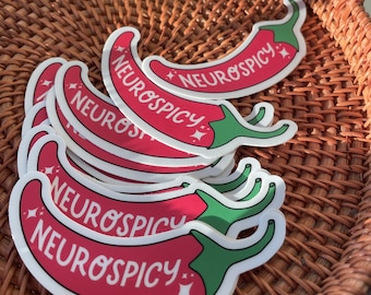 May include: A stack of red and green chili pepper stickers with the text "Neurospicy" on each one.