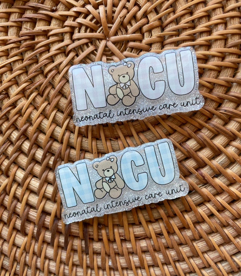 May include: Two rectangular badges with the letters "NCU" in white, with a teddy bear illustration. The background of the letters is a light blue and white gingham pattern. The text "neonatal intensive care unit" is below the letters.
