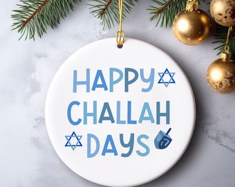 May include: White ceramic ornament with blue and white text that reads "Happy Challah Days" with a blue Star of David and a blue dreidel.