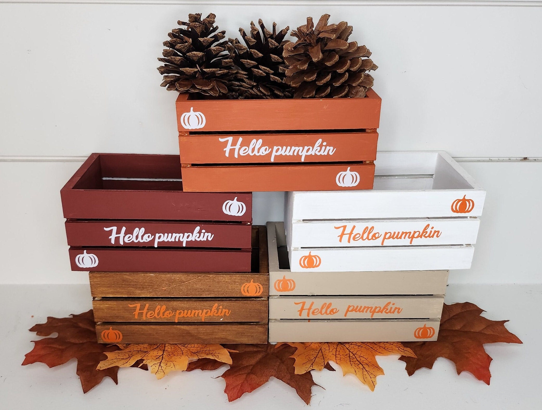 Five mini crates with Hello Pumpkin vinyl inscription for fall decor.