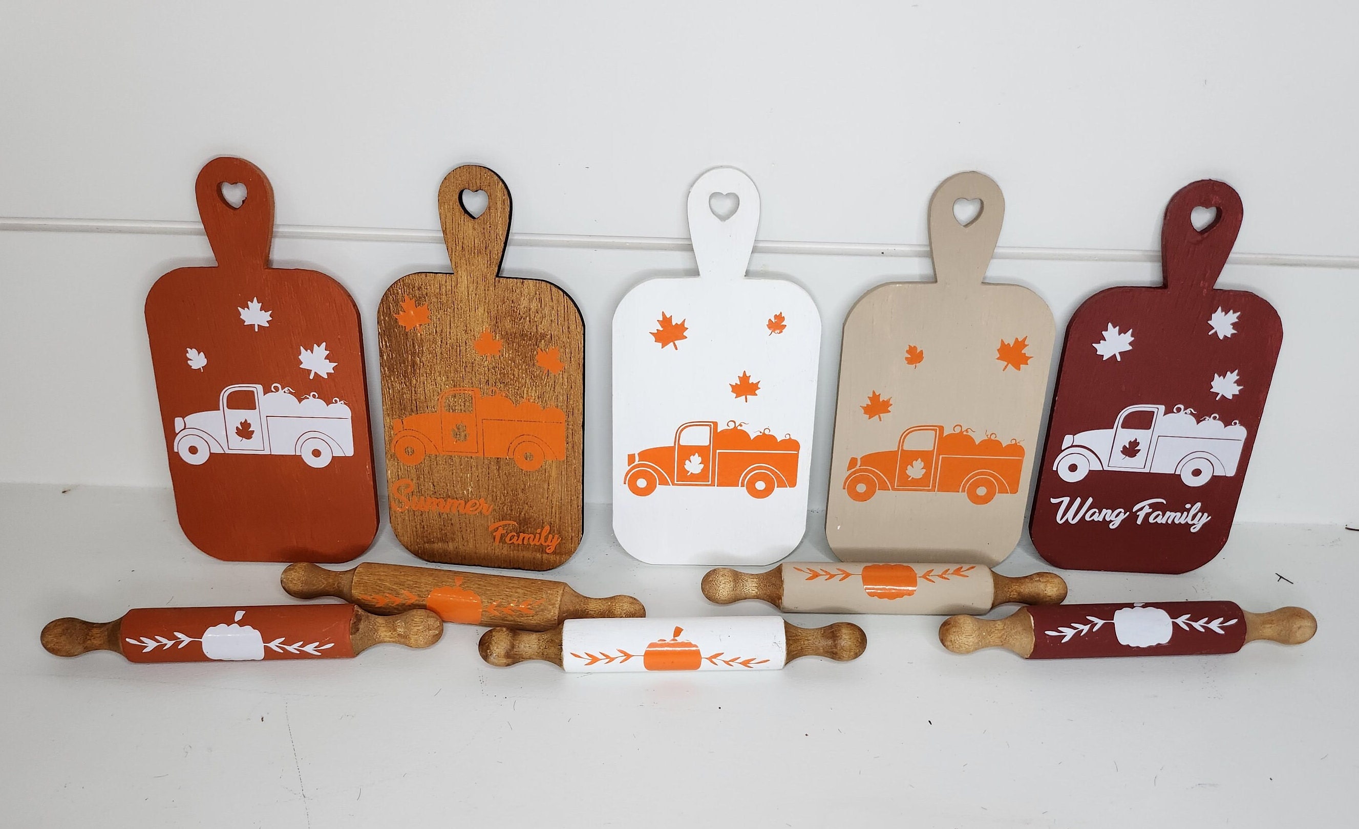5 mini cutting boards and 5 white mini rolling pins for fall decor.