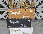 Rustic wooden utensil holder for graduation party decor, class of 2025.
