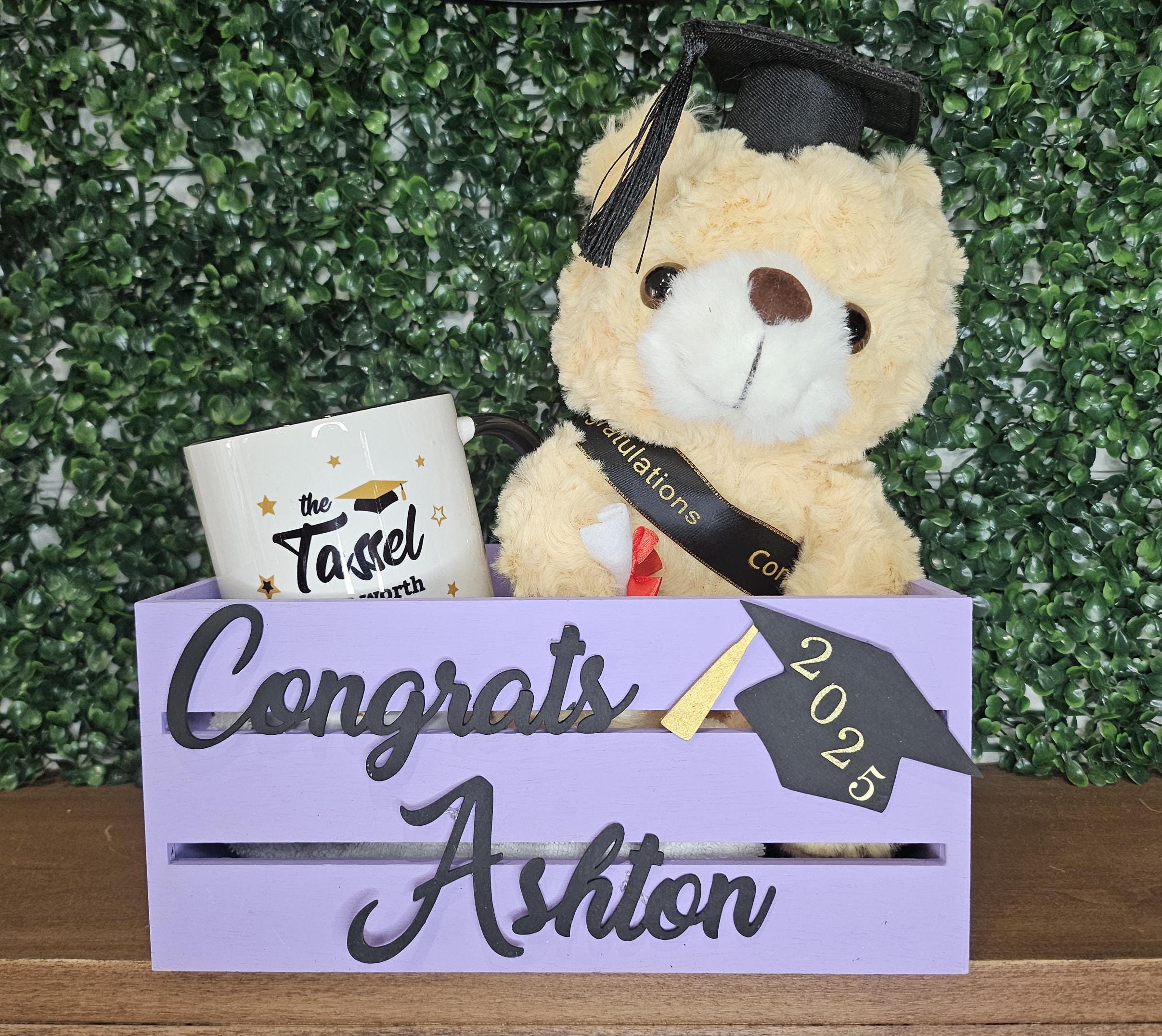 Custom purple wooden graduation crate with a black name and a grad owl design featuring the graduation year. Perfect for holding gifts, cards, or as decor at graduation parties.