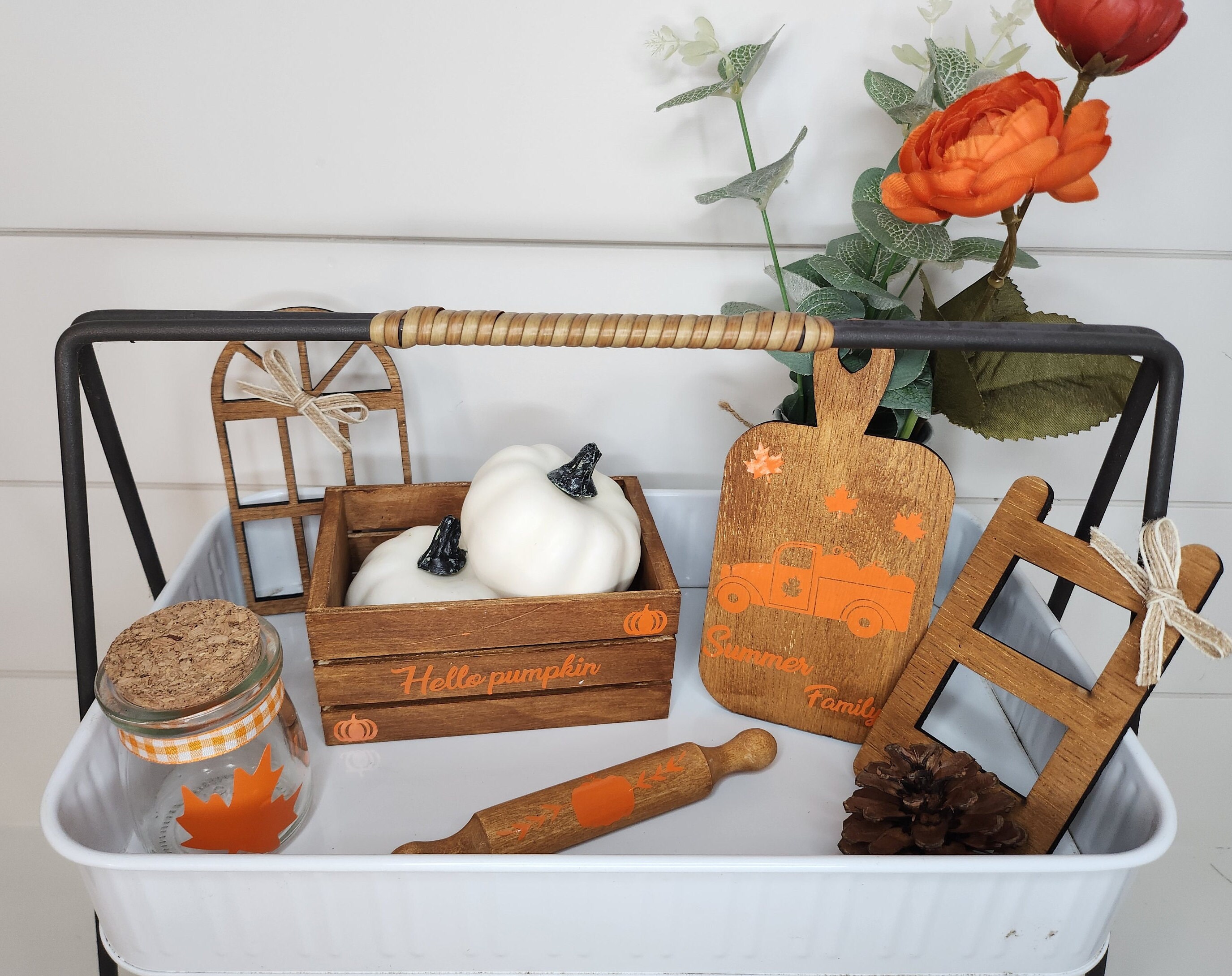 White Tray stand with fall decor including a stain mini crate with custom vinyl inscription, a jar with a maple leaf, a stained cutting board with orange custom vinyl design, stained rolling pin, stained mini window and small rustic ladder.