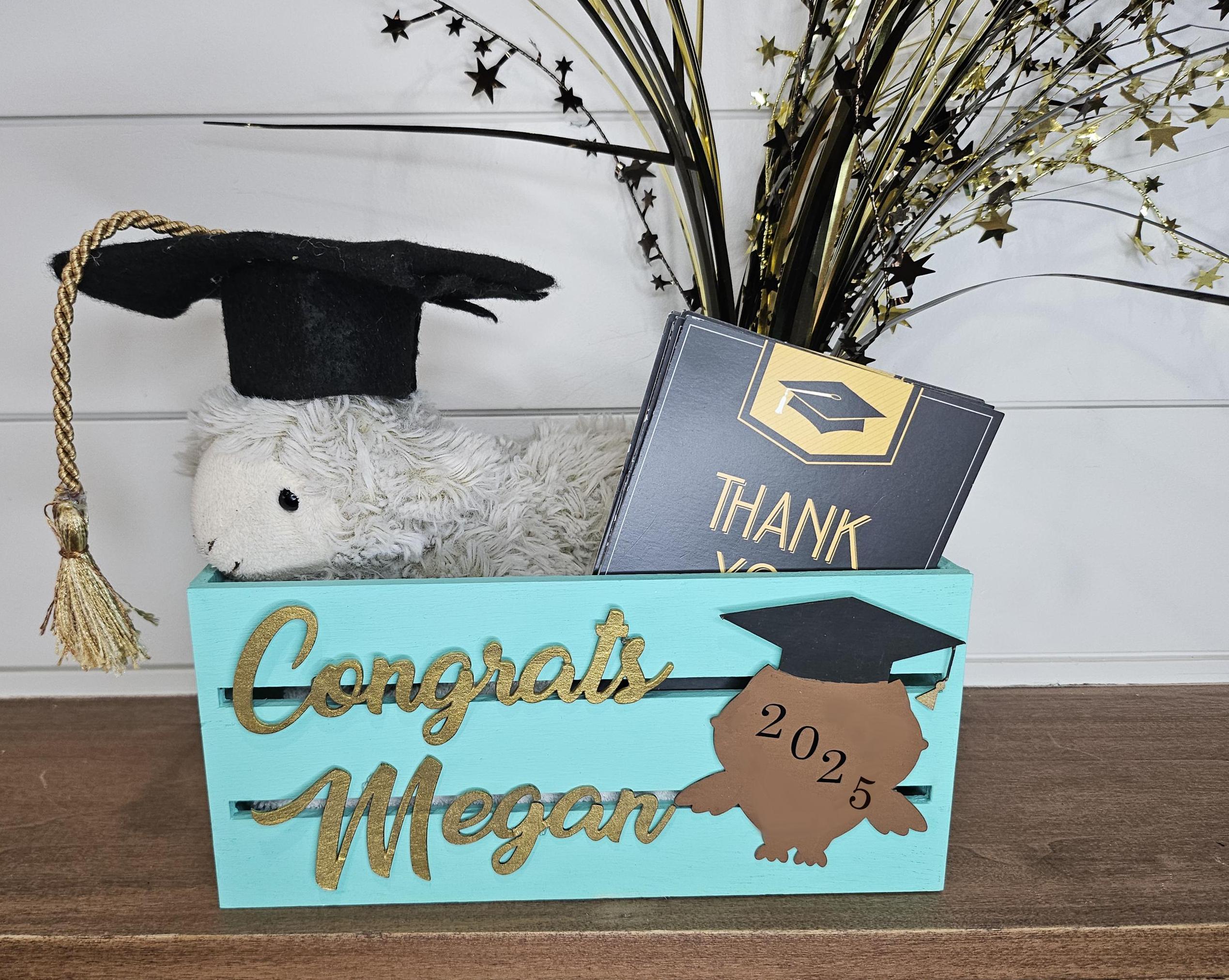 Custom teal wooden graduation crate with a gold name and a grad cap design featuring the graduation year. Perfect for holding gifts, cards, or as decor at graduation parties.
