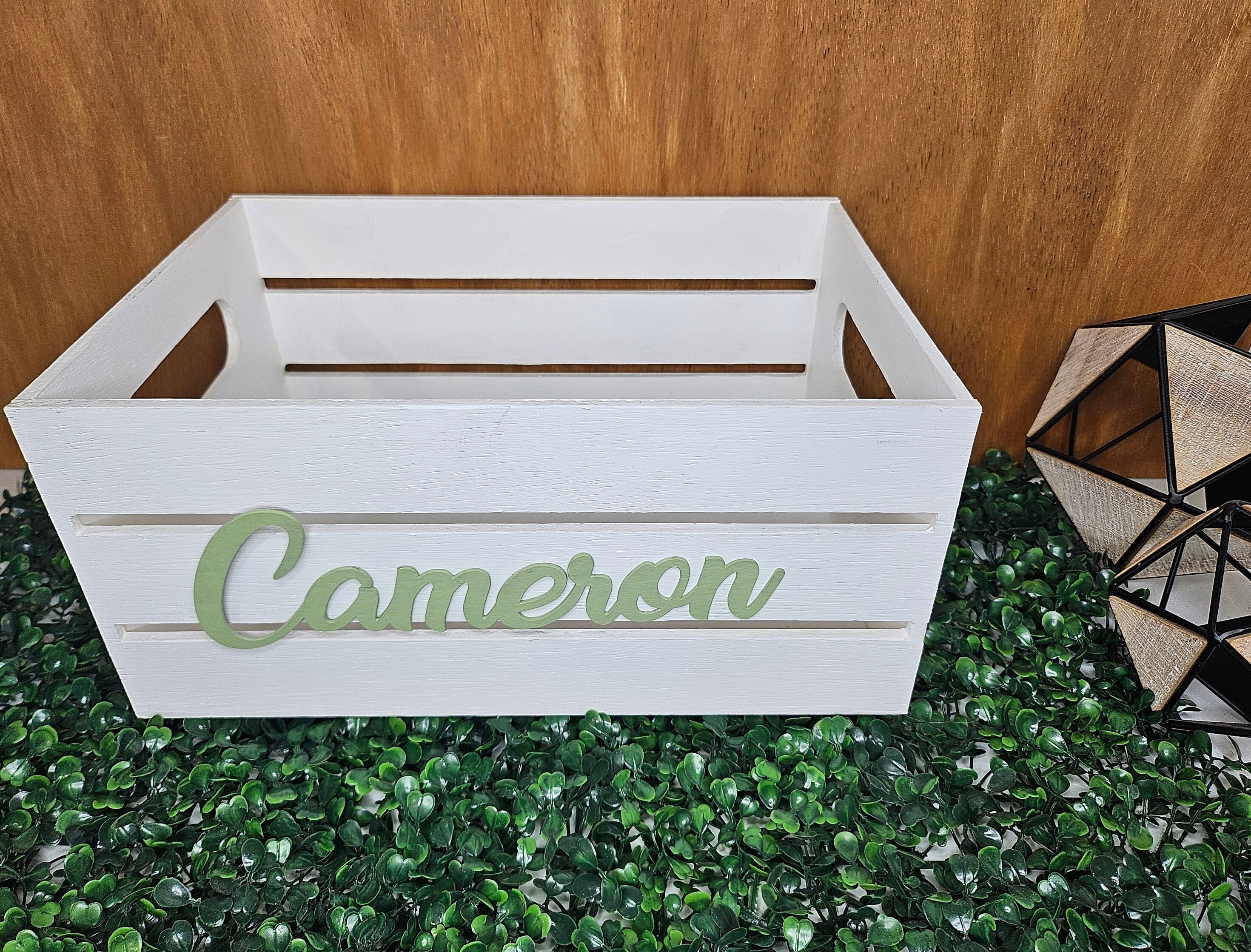 A white wooden crate with sage green name. Perfect for a nursery or kids room decor