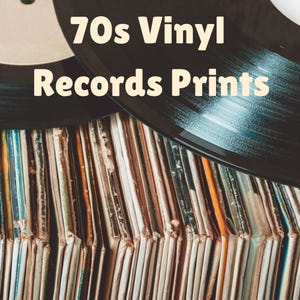 May include: A collection of vintage vinyl records stored in their paper sleeves, with two black vinyl discs resting on top. The text 70s Vinyl Records Prints is displayed in a light cream font over the records, which feature various colored spines.