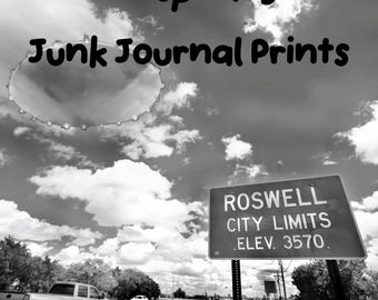 May include: A black and white graphic featuring the text Conspiracy Junk Journal Prints, a flying saucer shape in the sky, and a road sign reading Roswell City Limits Elev. 3570, with a pickup truck driving on a road below the cloudy sky.