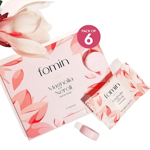 May include: A pack of six pink hand soap tablets in a white and pink floral design box. The box says "fomin Magnolia Neroli Hand Soap 6 Tablets".