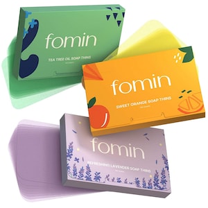 May include: Three boxes of Fomin soap thins, each with a different scent and color. The green box says "Tea Tree Oil Soap Thins", the orange box says "Sweet Orange Soap Thins", and the purple box says "Refreshing Lavender Soap Thins".