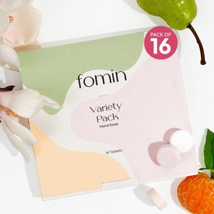 May include: A pack of 16 variety hand soap tablets from the brand fomin. The packaging is white with pink, green, and orange accents. The text on the packaging reads "fomin", "Variety Pack", "Hand Soap", and "16 Tablets".