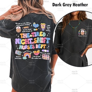 May include: A dark grey heather t-shirt with a colourful graphic design that says "The Tired Night Shift Nurses Dept." The graphic includes a rainbow, a heart, a first aid kit, and pills. The back of the shirt has a smaller graphic that says "Night Shift Crew Nurse Emma".