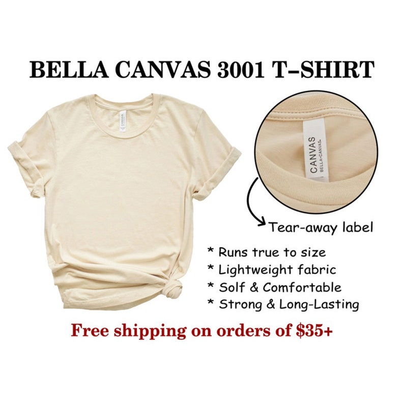 May include: A beige Bella Canvas 3001 T-shirt with a tear-away label. The label says "Canvas Bella Canvas". The shirt is lightweight, soft, and comfortable. It runs true to size.