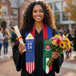 May include: A graduate in a black gown holds a diploma and a bouquet of flowers. The graduate wears a sash with the text "Class of 2026" and an American flag design. The sash also has a school crest and space for a name.