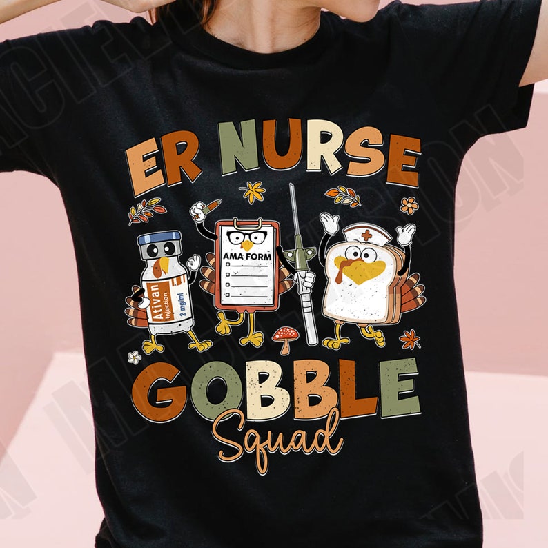 May include: A black t-shirt with a Thanksgiving-themed design featuring a turkey, a syringe, a bottle of medication, and a clipboard with the text "AMA FORM". The text "ER NURSE GOBBLE Squad" is printed in a vintage style.