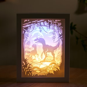Scatola luminosa intagliata in carta Scatola luminosa intagliata in carta Luce notturna Scatola luminosa a LED 3D Scatola delle ombre - Dinosauri