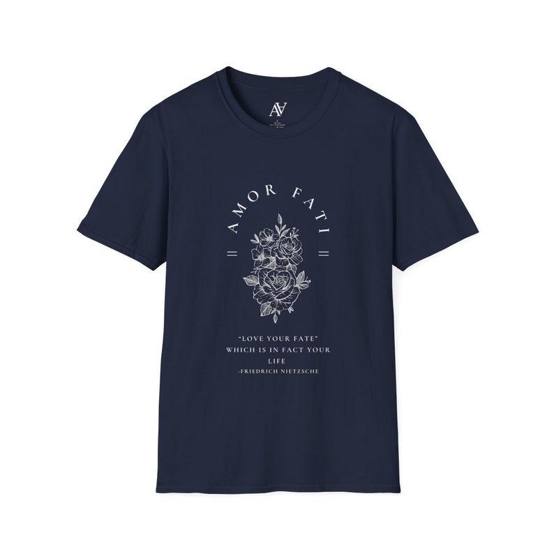 May include: Navy blue t-shirt with a white graphic print of a floral design and the text "AMOR FATI" above the flowers. The text below the flowers reads "LOVE YOUR FATE" WHICH IS IN FACT YOUR LIFE -FRIEDRICH NIETZSCHE