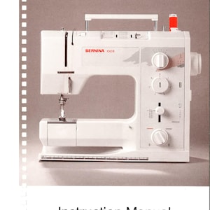 May include: A white Bernina 1008 Electronic sewing machine with a red spool of thread. The machine has a white handle and a white foot pedal. The machine is on a white surface. Instruction Manual is written below the image.