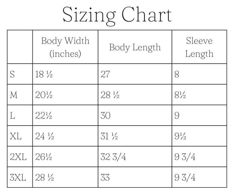 May include: Sizing chart for clothing with columns for size, body width in inches, body length in inches, and sleeve length in inches. Sizes include S, M, L, XL, 2XL, and 3XL.
