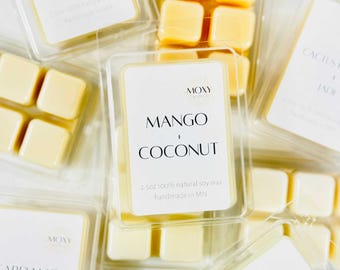 May include: Four wax melts in a clear plastic container with a white label that reads "MOXY Candles MANGO COCONUT 2.5 oz 100% natural soy wax handmade in MN".