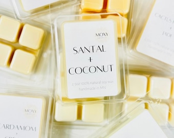 May include: A set of six wax melts in clear plastic containers. The wax melts are in a variety of scents, including Santal + Coconut, Cardamom + Cream, and Cactus + Jade. Each container is labeled with the scent and the brand name, "Moxy Candle Co.".