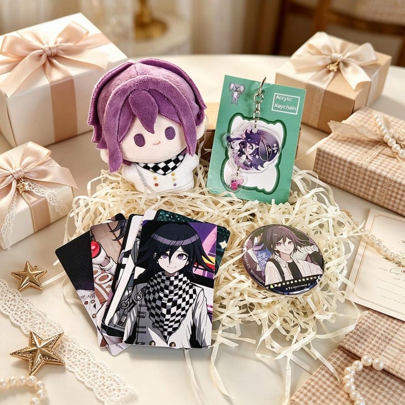 May include: A purple-haired plush doll, an acrylic keychain on a green card labeled Acrylic Keychain, a set of illustrated character cards, and a circular pin featuring a character with black hair, all nestled in shredded paper.