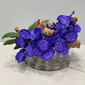 Silk orchid floral arrangement in cylinder vase \ arrangements \ centerpieces \ orchids centerpieces \ orchids arrangements