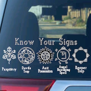 May include: A white sticker on a car with the text "Know Your Signs" and five different symbols with their names below them: Purgatory, Devils Trap, Anti Possession, Angel Banishing Spell, Reaper Trap.