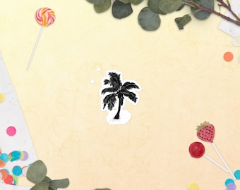 May include: A black and white illustration of a palm tree on a white background. The image is surrounded by confetti and greenery.