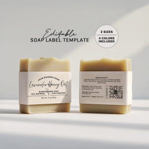 May include: Two bars of handcrafted soap with white labels. The front label reads "Lavender Honey Oat" and "Net Wt. 113 g." The back label lists ingredients and directions. The image also includes text that says "Editable SOAP LABEL TEMPLATE."