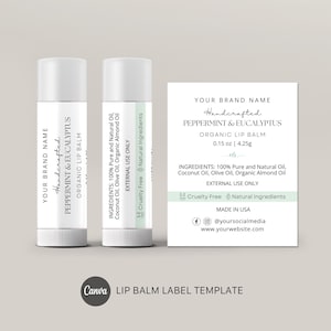 May include: Two white lip balm tubes and a label with text. The label reads "Handcrafted Peppermint & Eucalyptus Organic Lip Balm" and lists ingredients. The label also includes social media handles and website information. The lip balm is 0.15 oz.