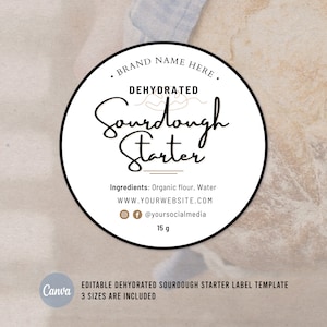 May include: A white round label with a black border. The label says "BRAND NAME HERE. DEHYDRATED Sourdough Starter" in black text. Below the text, it says "Ingredients: Organic flour, Water WWW.YOURWEBSITE.COM @f@yoursocialmedia 15 g".