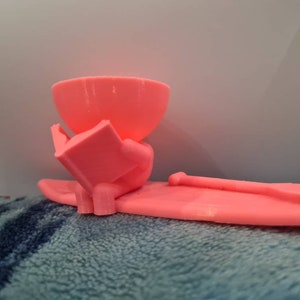 Paddleboarder hollow head air plant holder reading a book