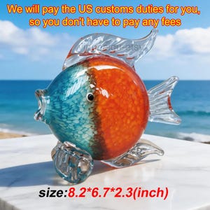 May include: A decorative glass fish sculpture with a vibrant color scheme. The fish features a blue and orange design, with clear fins and tail. The dimensions are 8.2*6.7*2.3 inches. The text in the image says "We will pay the US customs duties for you, so you don't have to pay any fees."